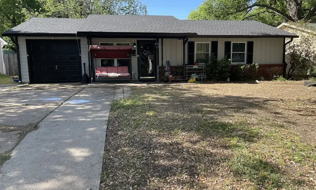 Asphalt Shingle Roof Repair crew at work on a residential roof in Kilgore